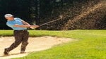 Player hitting from bunker